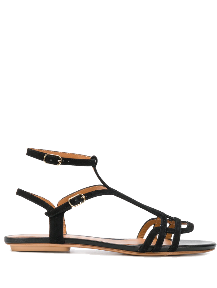 Sandalia plana de mujer en ante negro, modelo YAEL de Chie Mihara, con puntera abierta, doble tira al tobillo y tacón de 1,5 cm. Hecha en España.