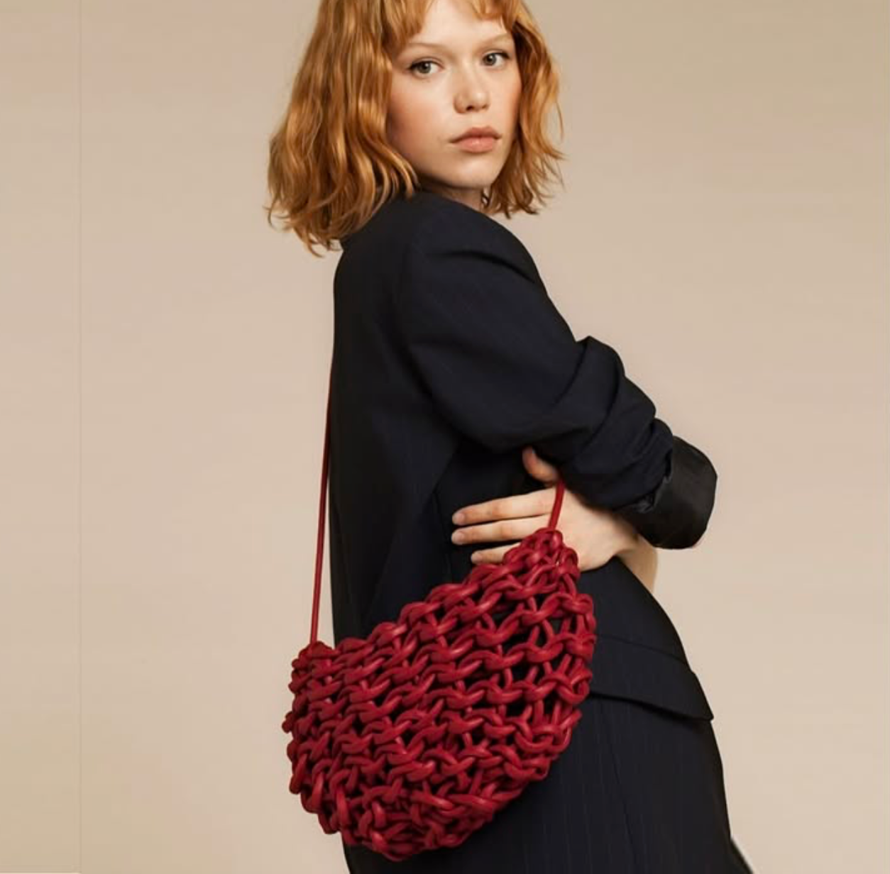 Detail of Alienina Cecilia red woven waxed cotton rope bag texture