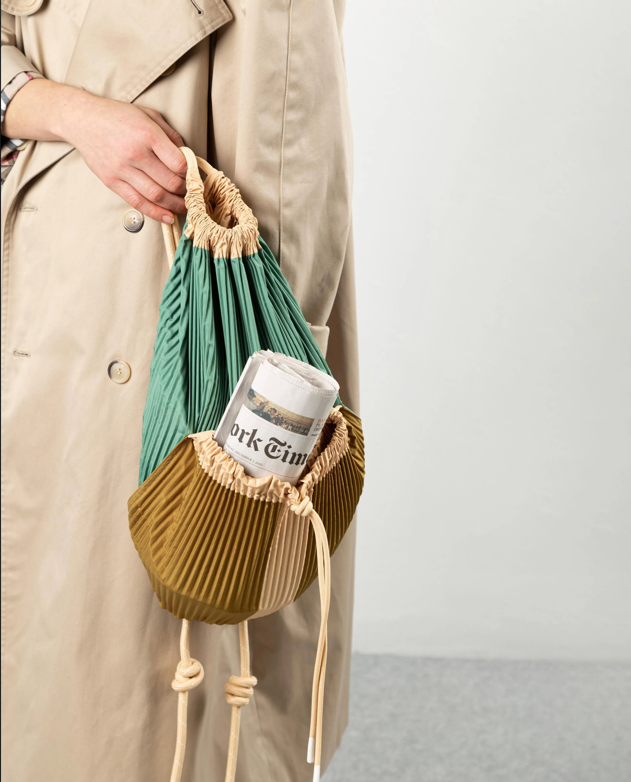 Multitudes Gae backpack detail with front pockets and drawstring closure