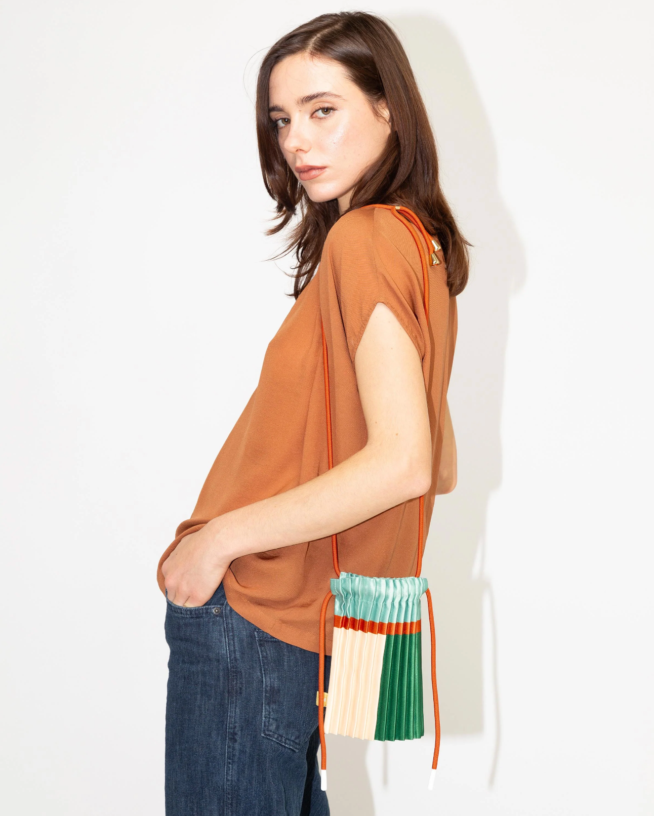 Multitudes pleated mini bag Esmerald green mint worn crossbody side view