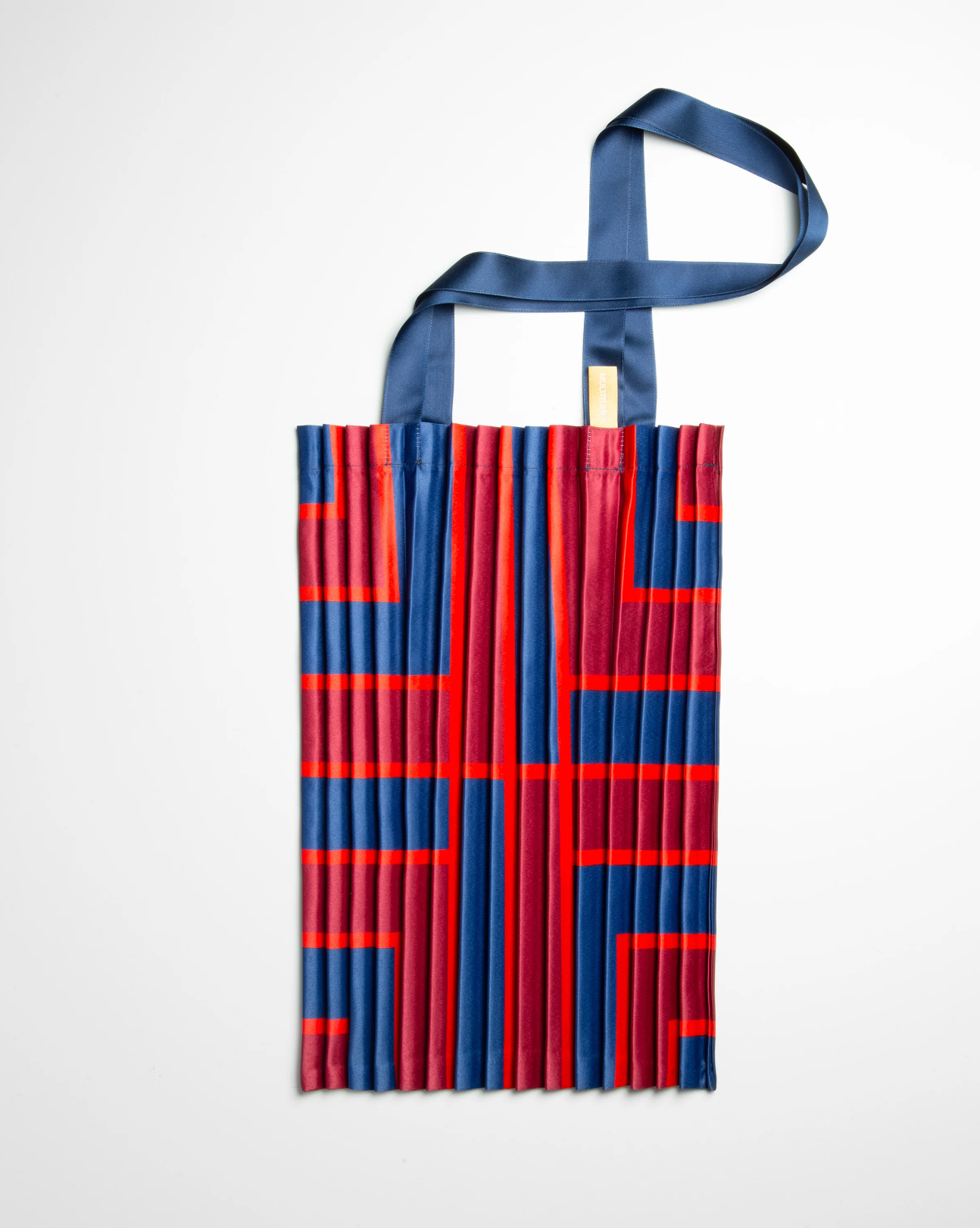 Multitudes tote bag Stintino blue red burgundy pleated satin geometric print flat lay