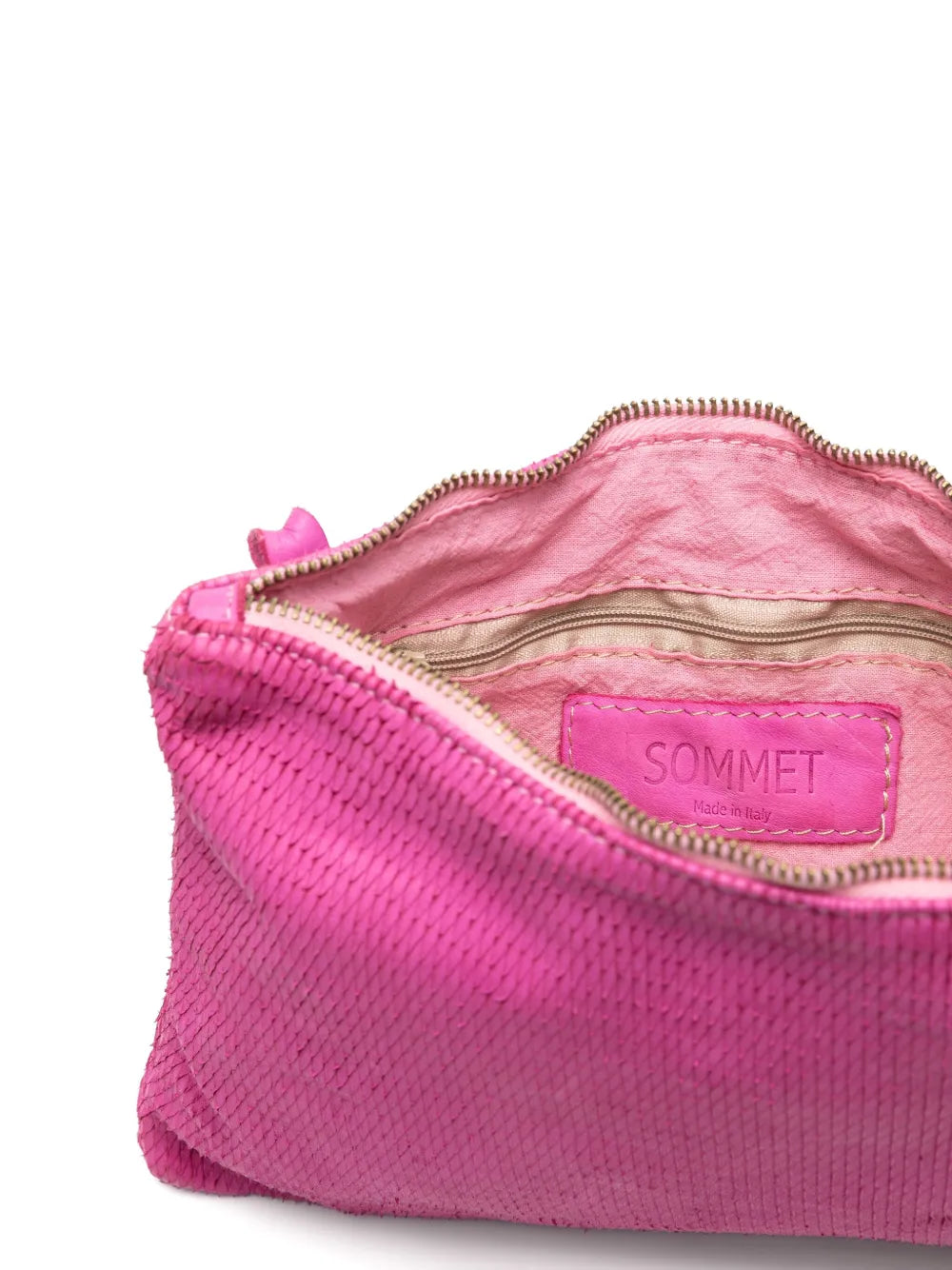 Sommet Petaliño pochette bag in magenta, crafted from vegetable-tanned calfskin with petal effect, adjustable and removable strap, zipper closure, interior compartments, handmade in Italy.