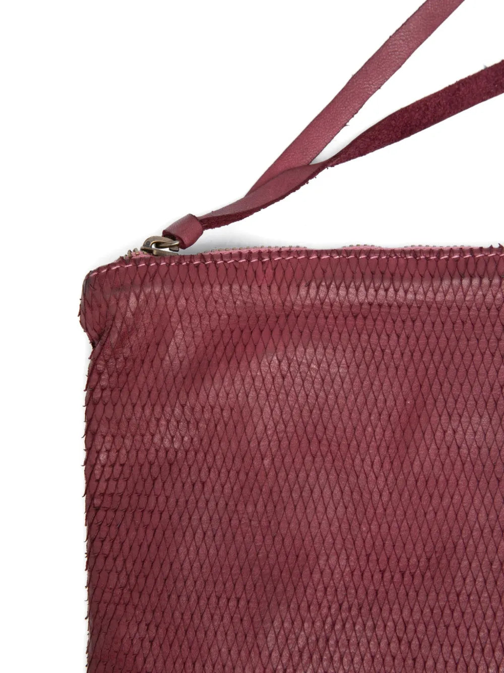 Sommet Petalino pochette bag in burgundy prugna, crafted from vegetable-tanned calfskin with petal effect, adjustable and removable strap, zipper closure, interior compartments, handmade in Italy.