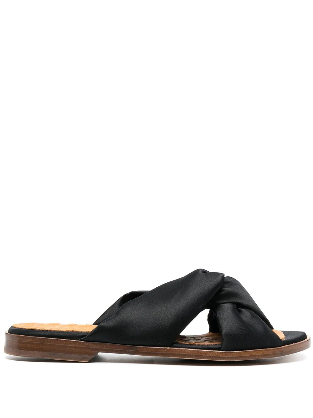 Chie Mihara Wamuza black satin twisted cross-strap flat mule sandal with leather insole, handmade in Spain