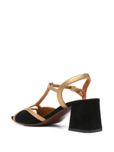 Load image into Gallery viewer, Sandalia Chie Mihara LIPE de tacón medio en ante negro con detalles dorados, tira al tobillo y cierre con hebilla lateral. Diseño elegante y cómodo, hecho en España