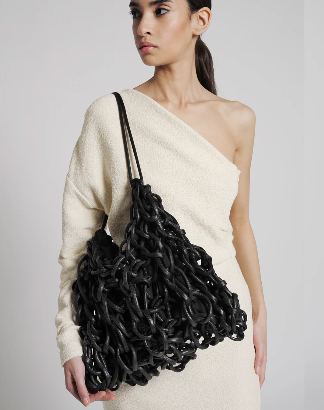 black woven shoulder bag handmade Italy recycled cotton designer bag worn look Alienina Petra
