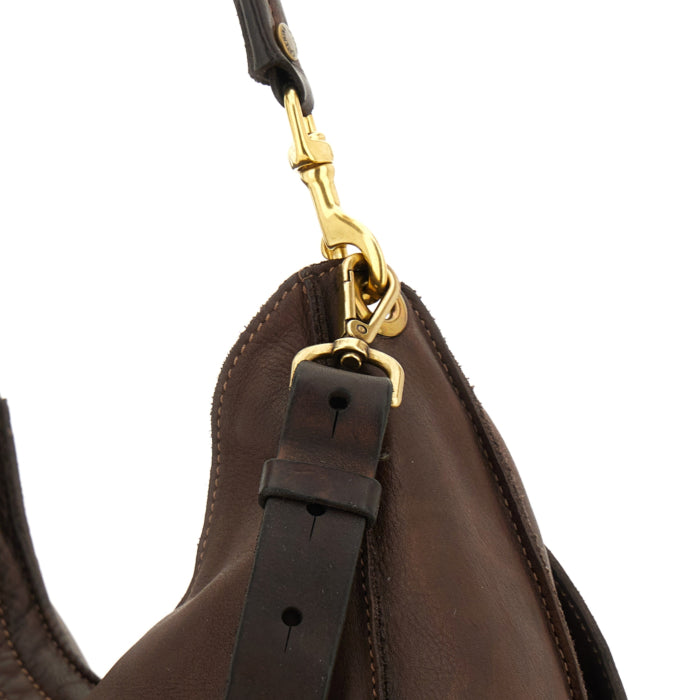 Ludovica M Moro bag by Caterina Lucchi, close-up of gold hardware clasp and leather strap detail
