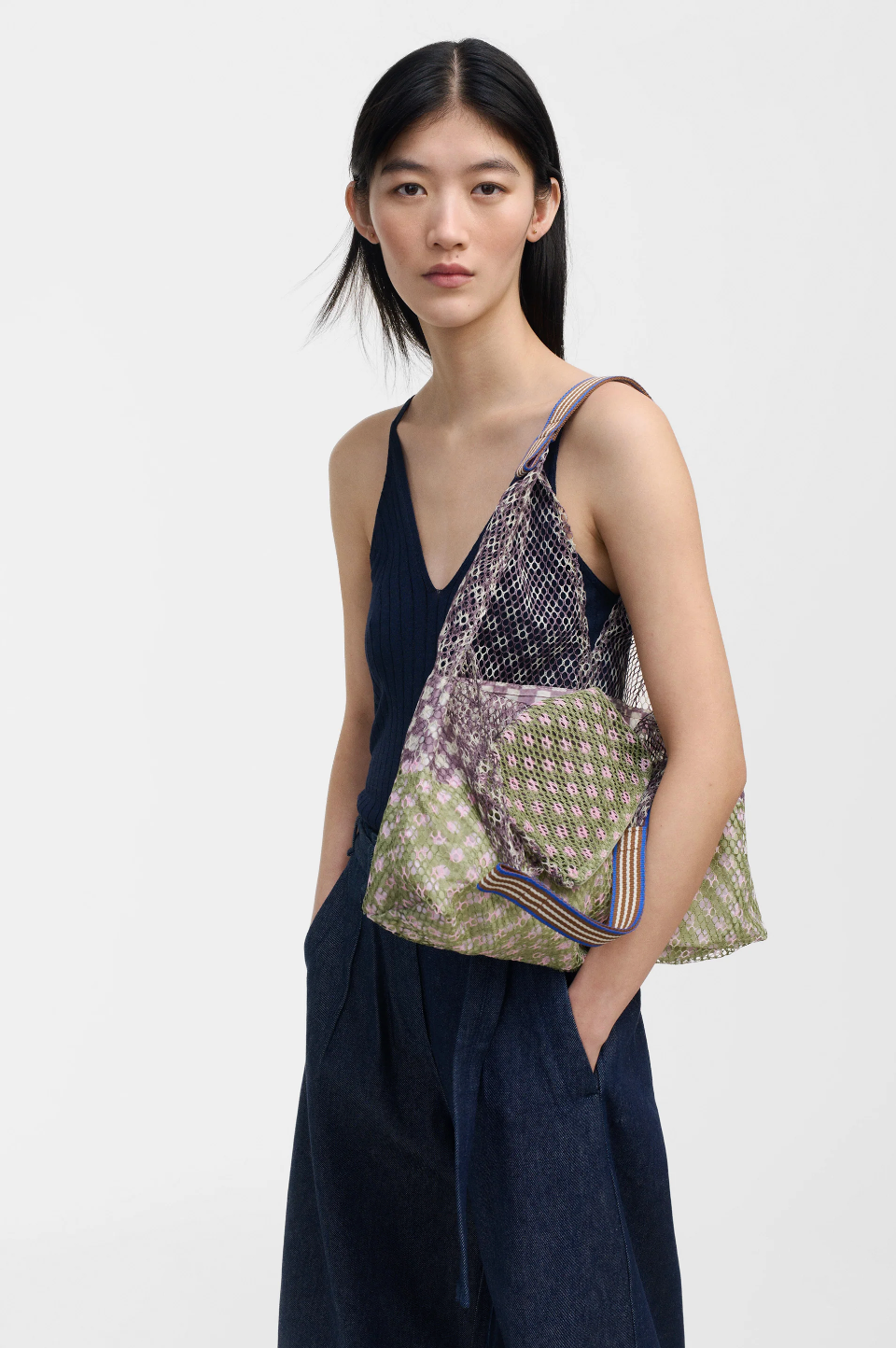 Épice Paris Elziver Small Tote Bag in Moss — geometric multicolor mesh bag in moss green and earth tones, carried over the shoulder, styled with navy slip dress