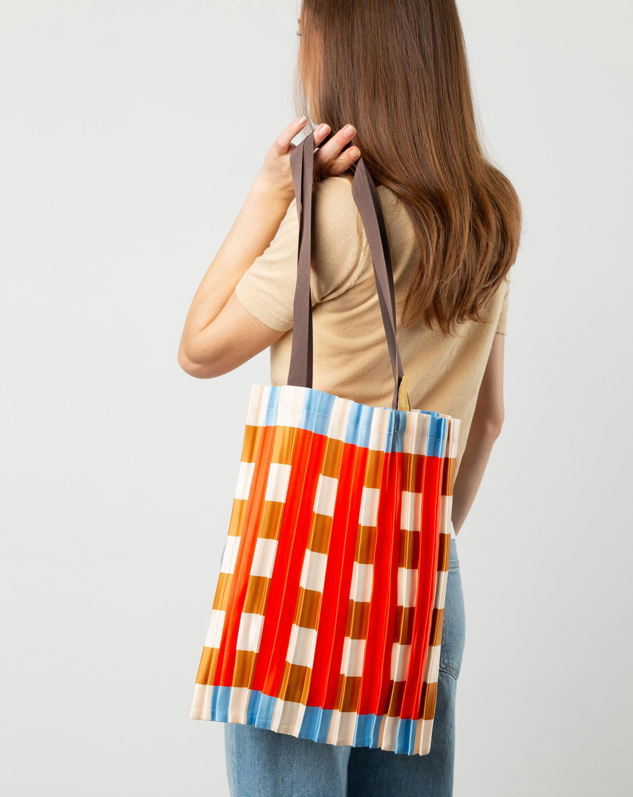 Multitudes Marsala tote bag with vertical striped pleated design in red
