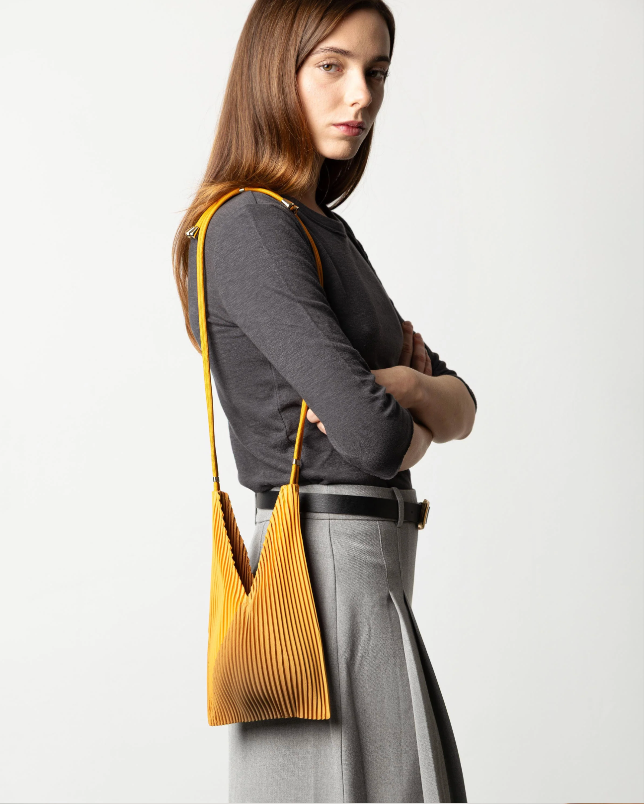 Multitudes pleated baby bag Artisan gold worn crossbody side view
