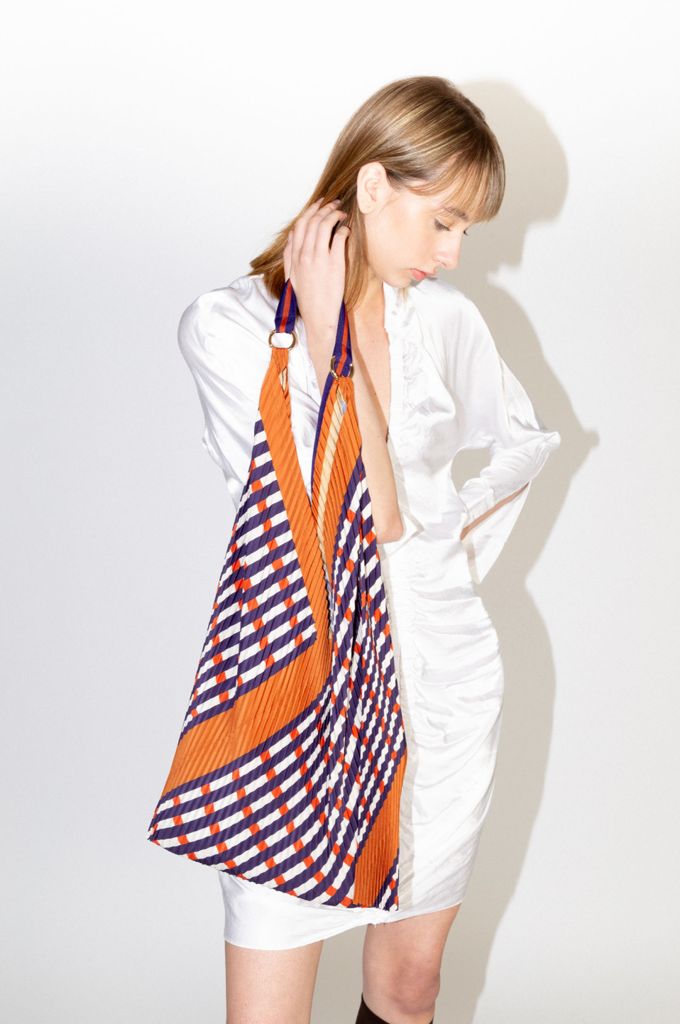 Multitudes Sophia Terracota bag with diagonal pleated pattern in recycled satin