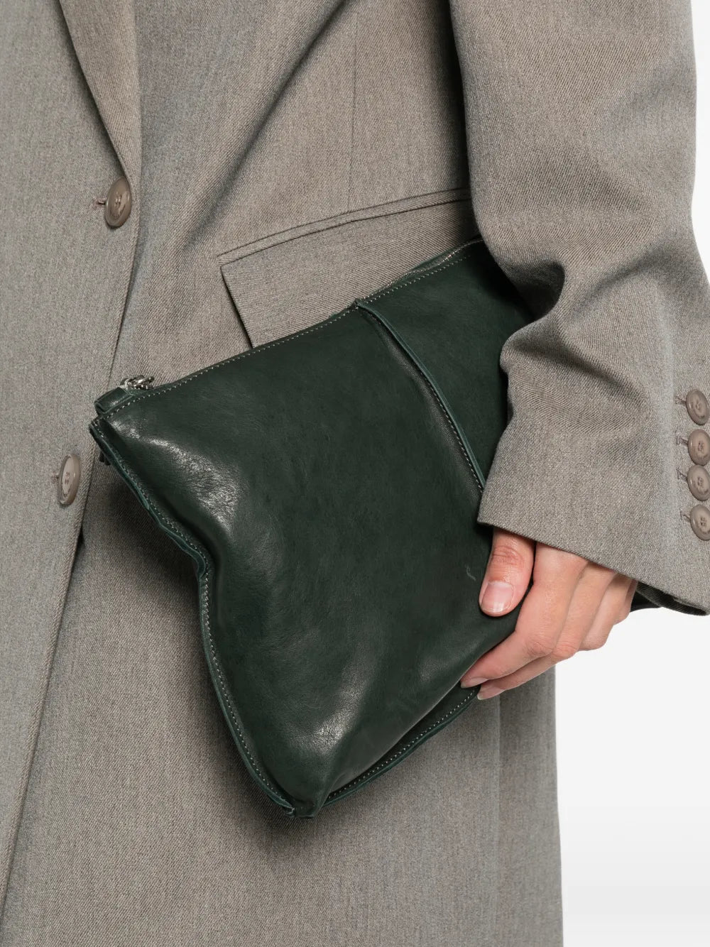 Sommet Clark crossbody bag in deep cadet green vegetable-tanned leather with adjustable strap and waxed artisanal finish, handmade in Italy.