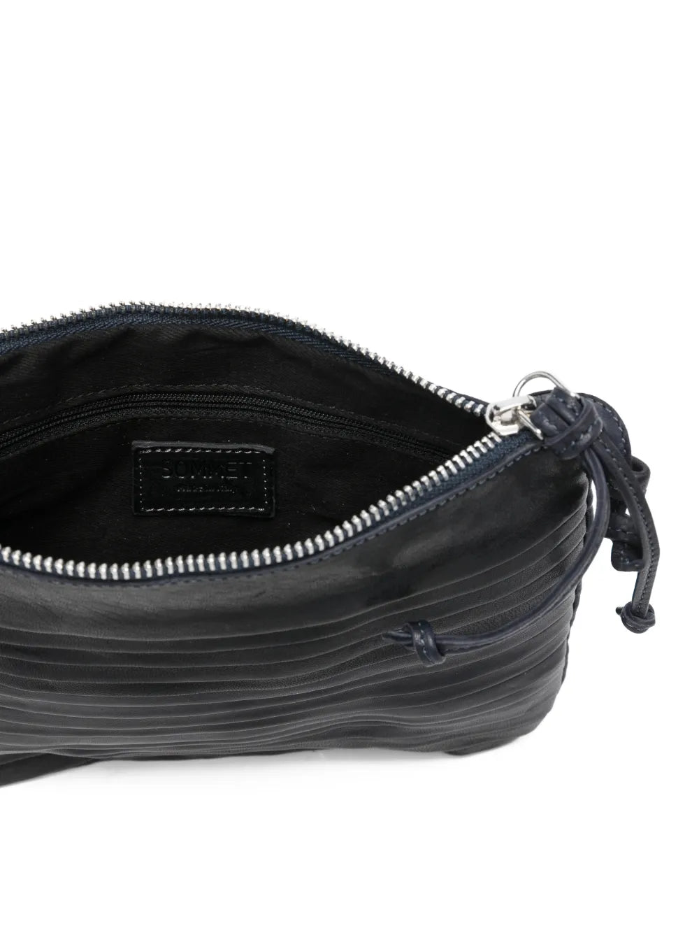 Small navy blue leather crossbody bag with horizontal pleated texture and adjustable strap, handcrafted in Italy, displayed on a white background.