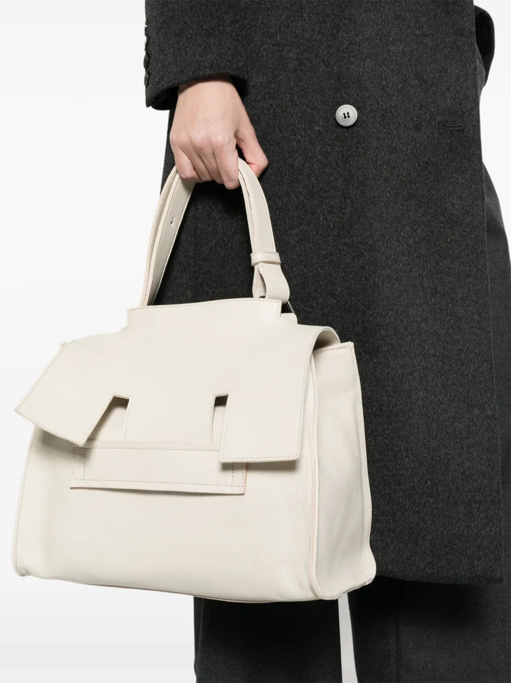 Sommet Mayway Little ivory leather handbag with structured silhouette, geometric flap detail and adjustable top handle, handcrafted in Italy.