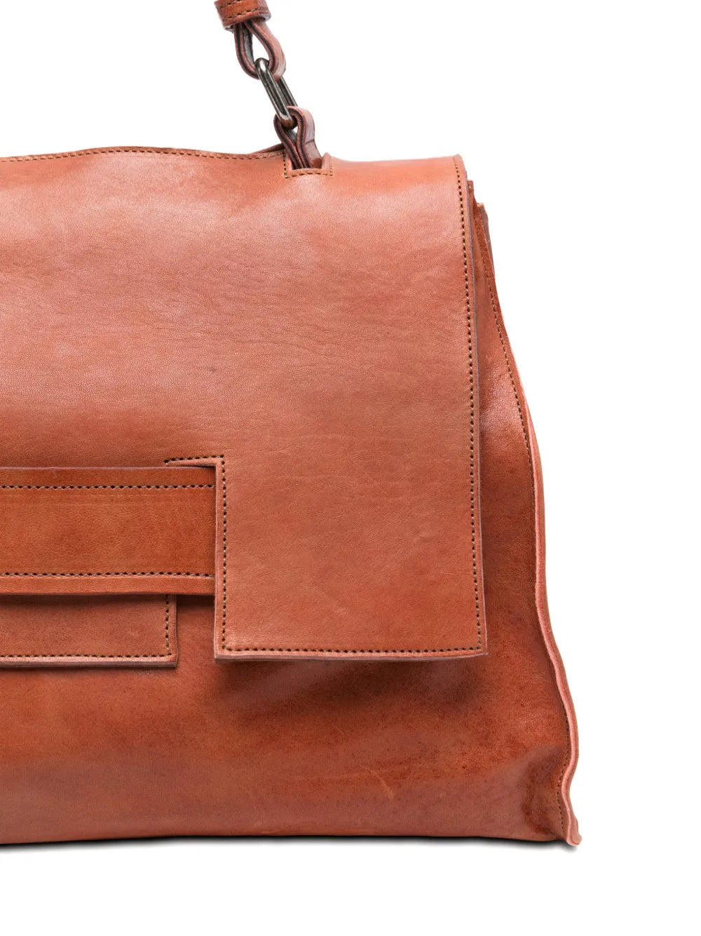 Sommet Mayway Little siena leather handbag carried by hand, structured silhouette with geometric flap detail, handcrafted in Italy.