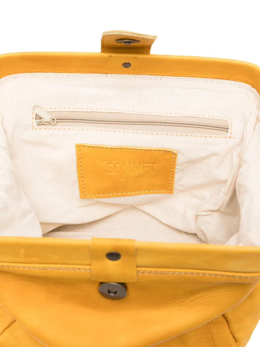 Sommet mustard yellow (giallo) lambskin clutch and crossbody bag handmade in Italy – vegetable-tanned leather, magnetic closure, adjustable strap.