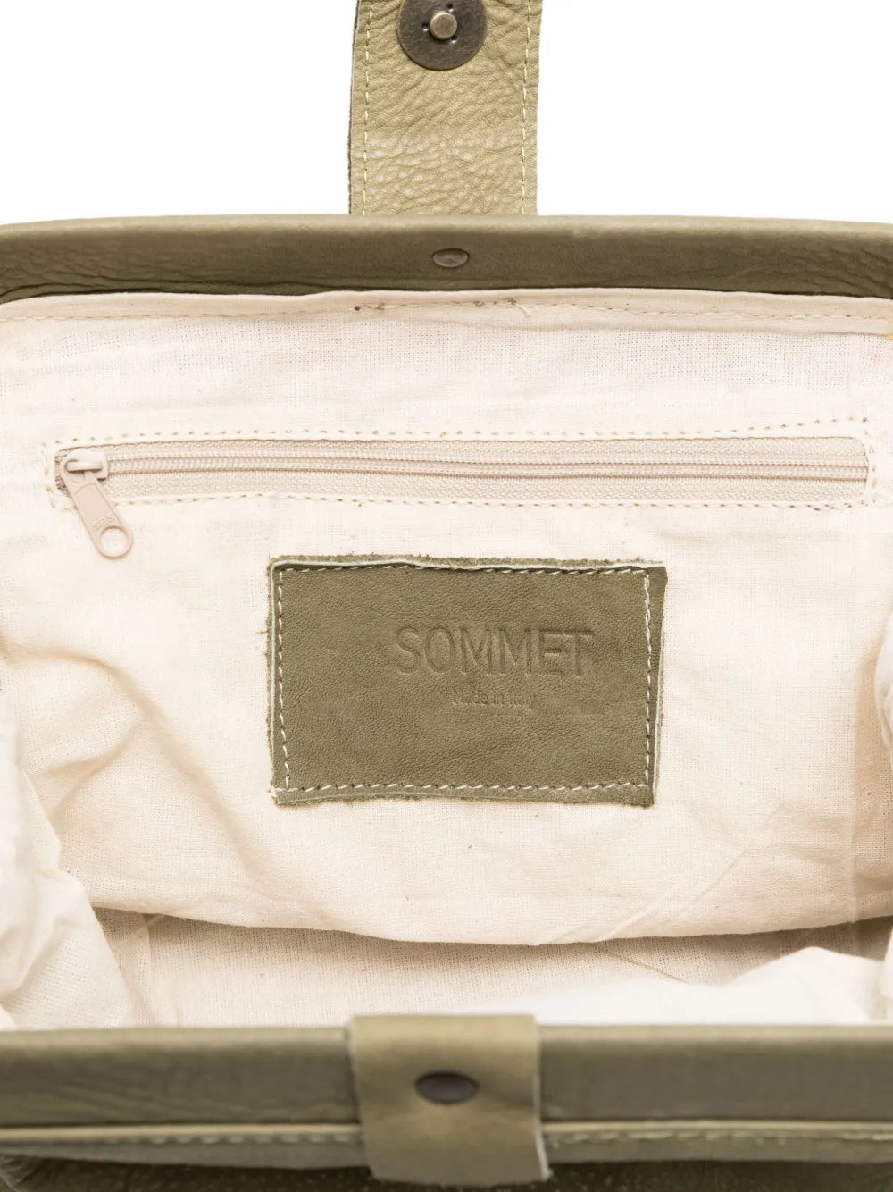 Sommet olive green lambskin clutch and crossbody bag handmade in Italy – vegetable-tanned leather, magnetic closure, adjustable strap.