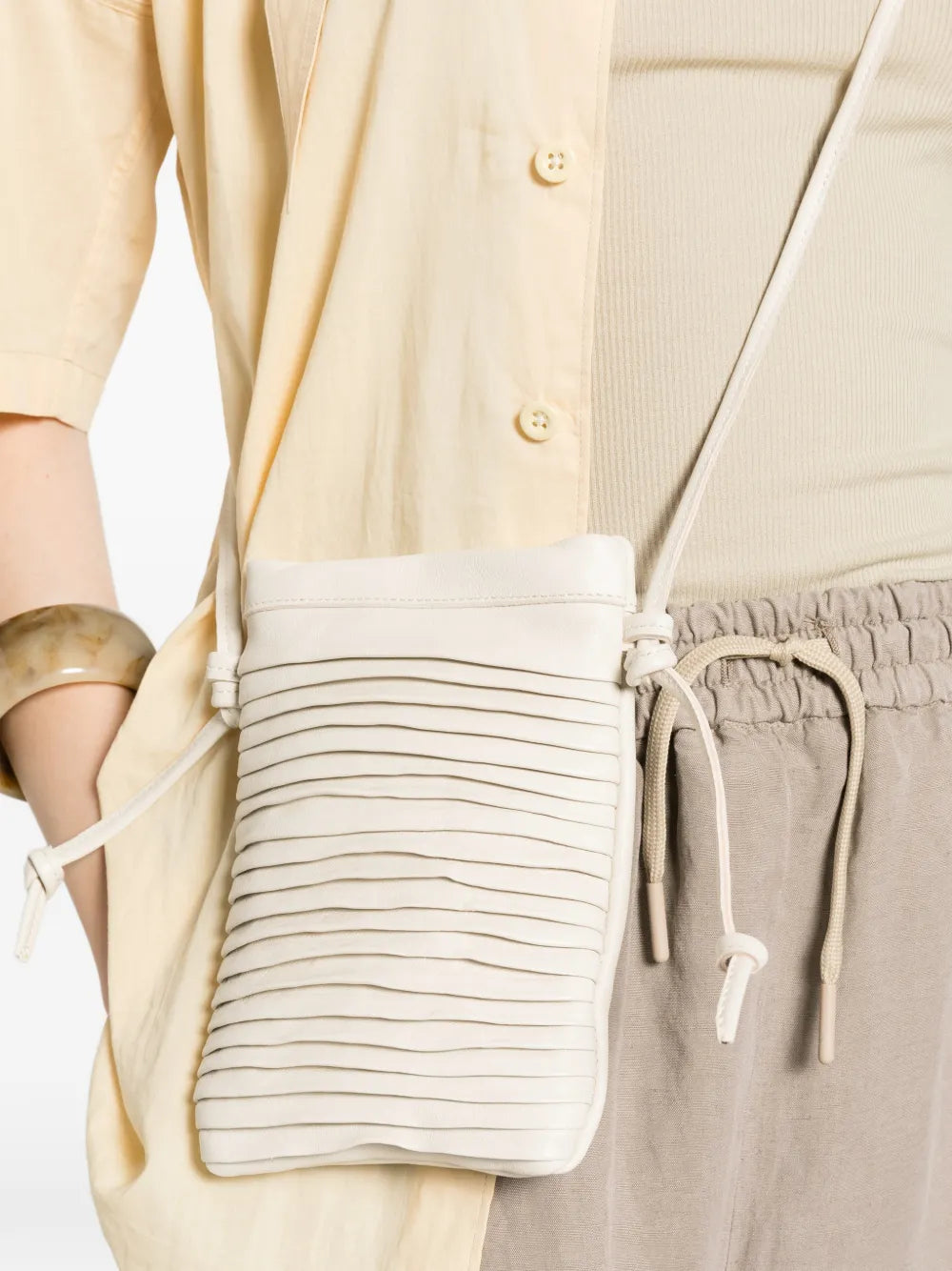 Sommet Paloma Rows ivory leather crossbody bag in vegetable tanned calfskin with handcrafted pleated texture, made in Italy.