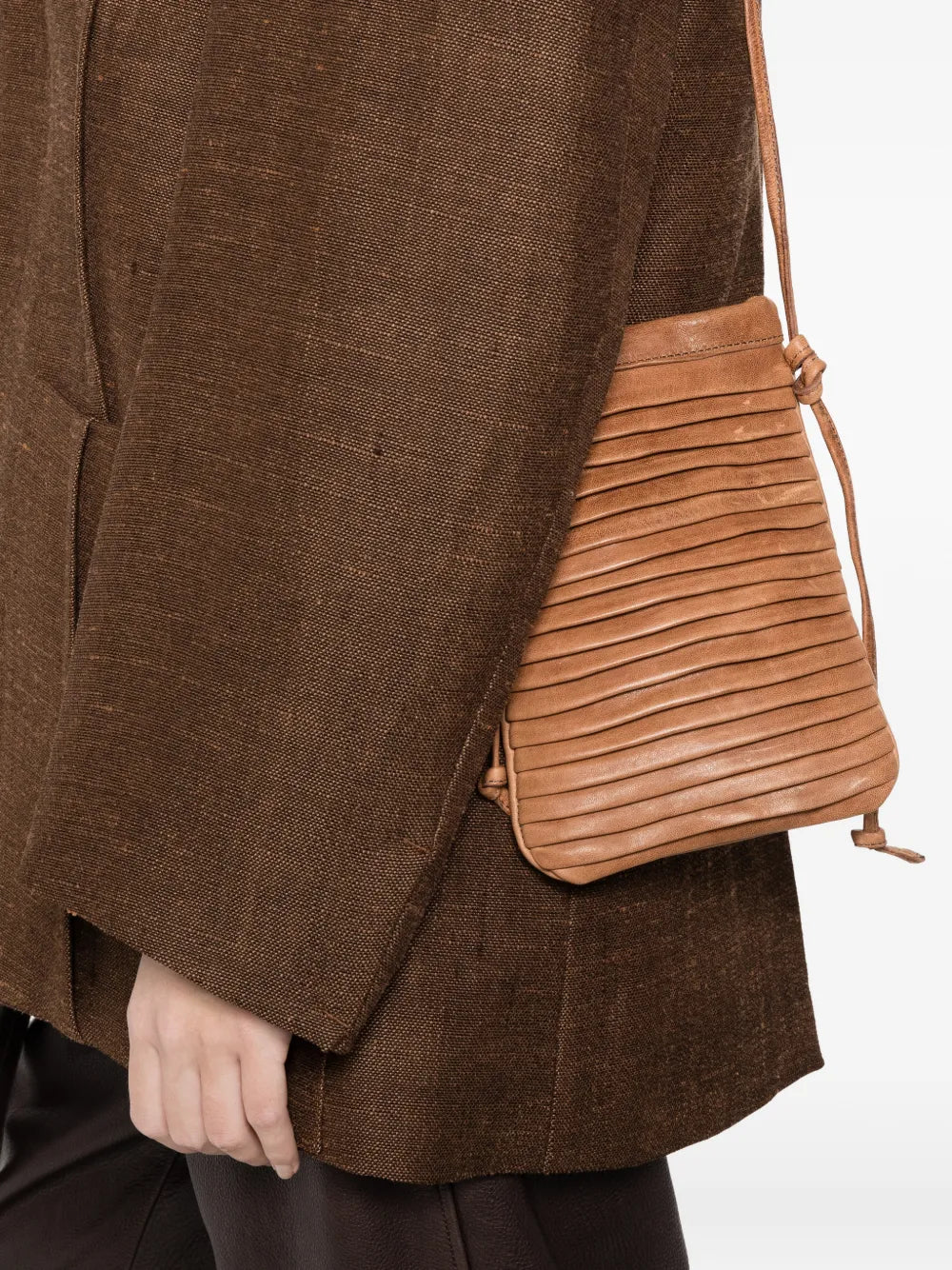 Sommet Paloma Rows crossbody bag in sand vegetable-tanned leather with handcrafted pleated texture and adjustable strap, made in Italy.