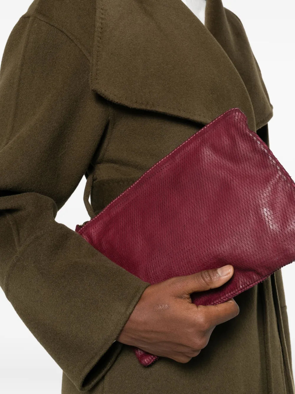 Sommet Petalino pochette bag in burgundy prugna, crafted from vegetable-tanned calfskin with petal effect, adjustable and removable strap, zipper closure, interior compartments, handmade in Italy.