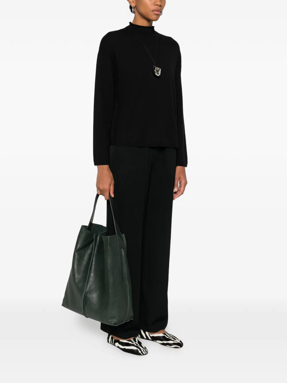 Sommet Sahara bucket bag in deep cadet green vegetable-tanned leather with removable interior pouch and waxed artisanal finish, handmade in Italy.