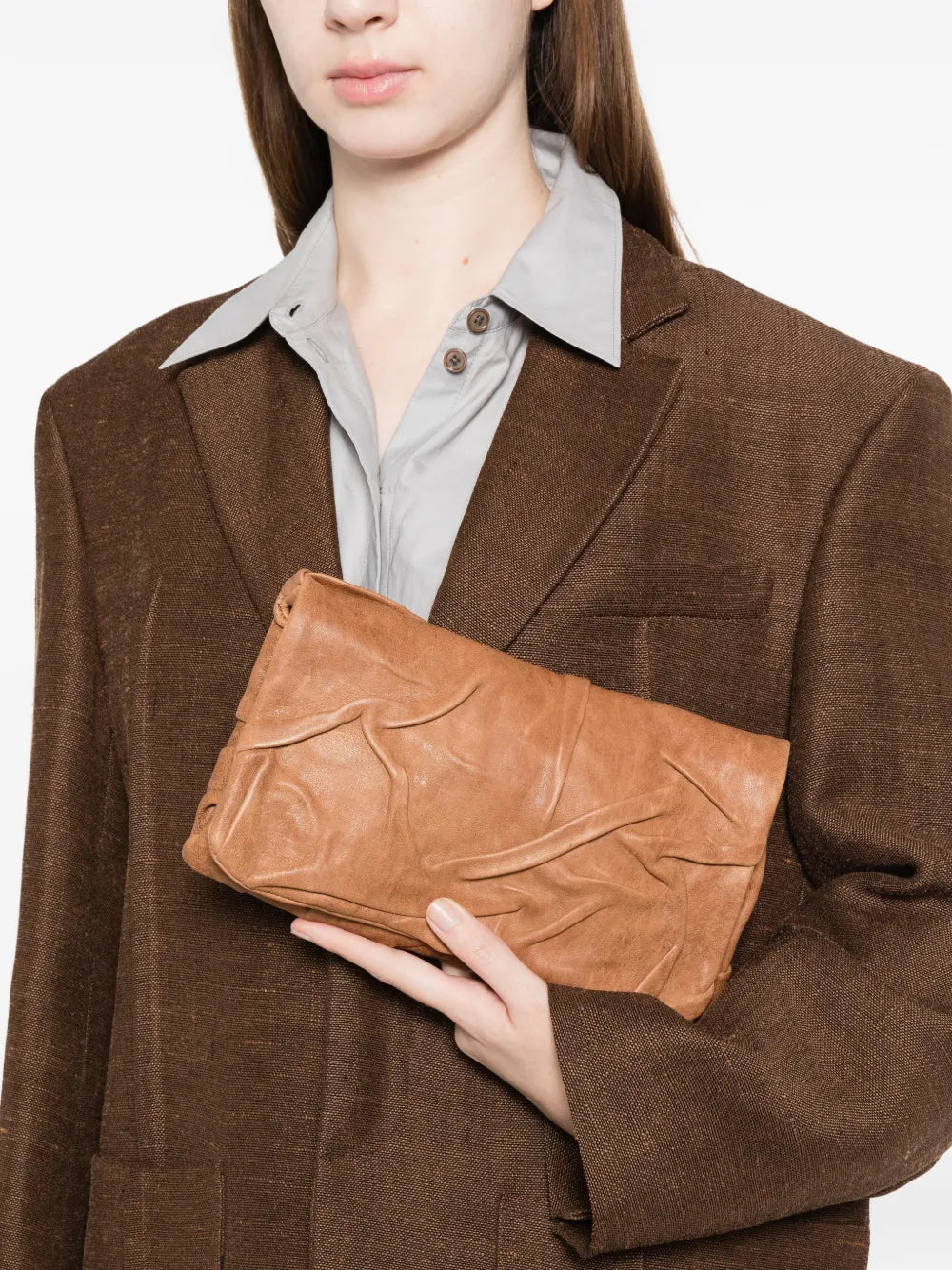 Soffieta Plum leather clutch and crossbody bag in sand color by Sommet, handcrafted in Italy from vegetable tanned calfskin with sculpted draped detailing.
