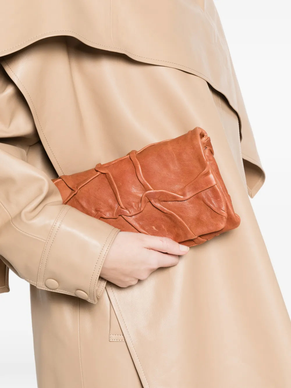 Soffieta Plum leather clutch and crossbody bag in siena color by Sommet, handcrafted in Italy from vegetable tanned calfskin with sculpted draped texture.