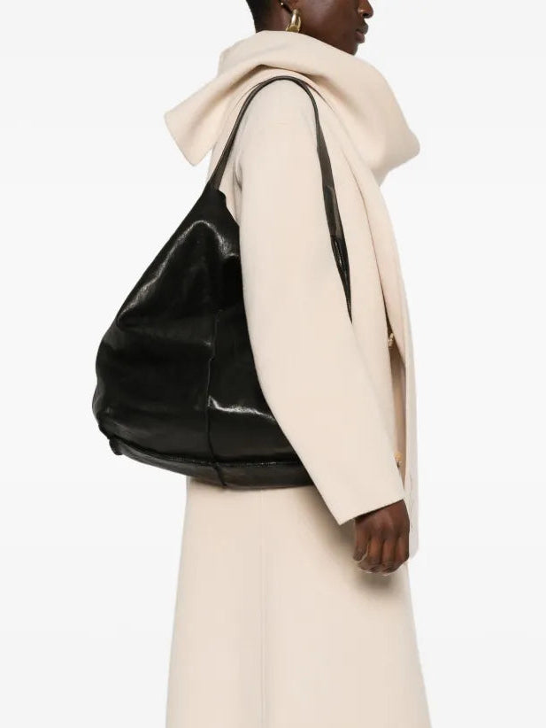 Sommet Sahara hobo bag in black vegetable-tanned leather, handmade in Italy with removable interior pouch.